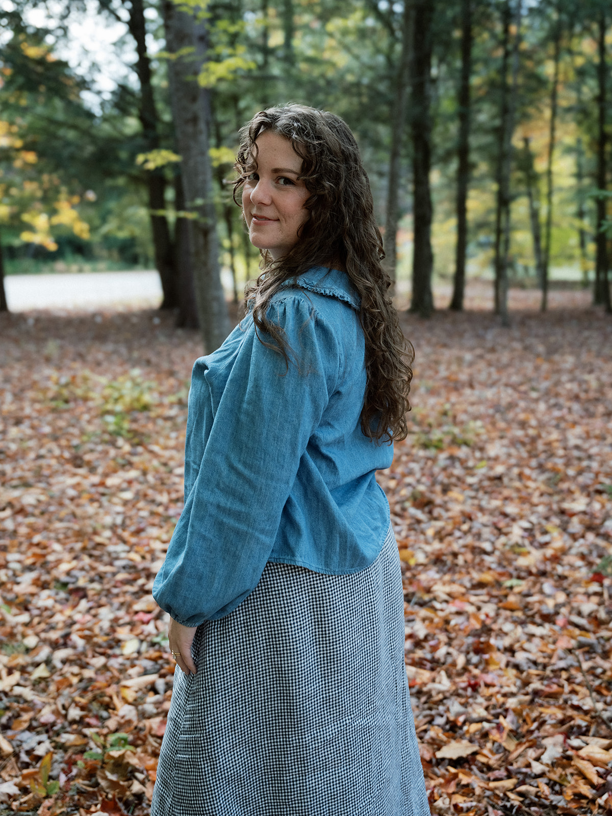 A mother in the autumn woodland